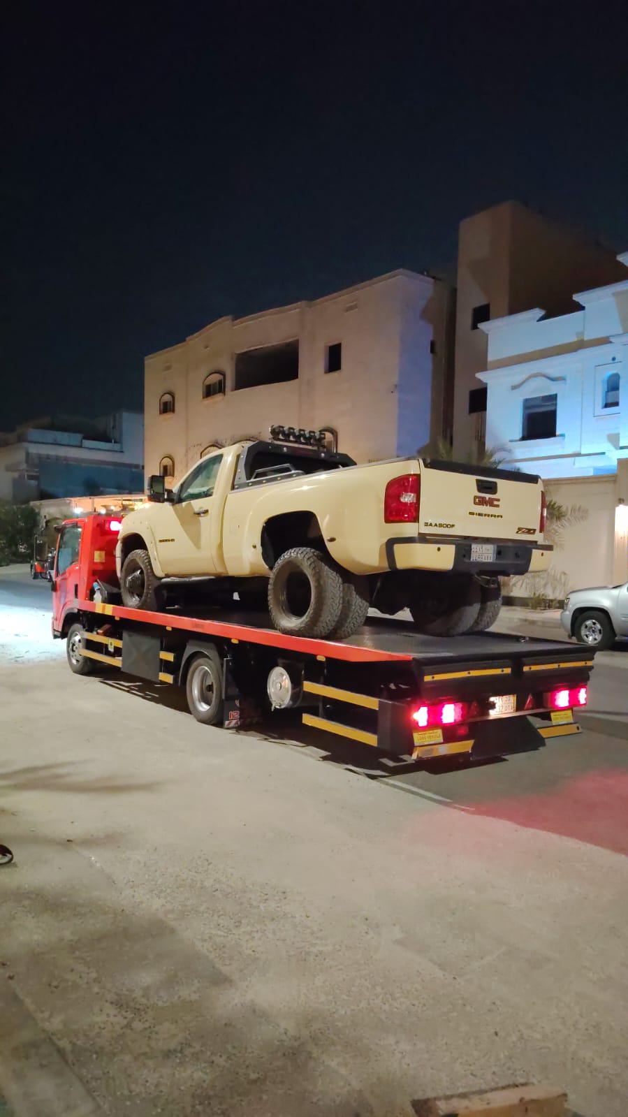 GMC pickup — flatbed towing in the city