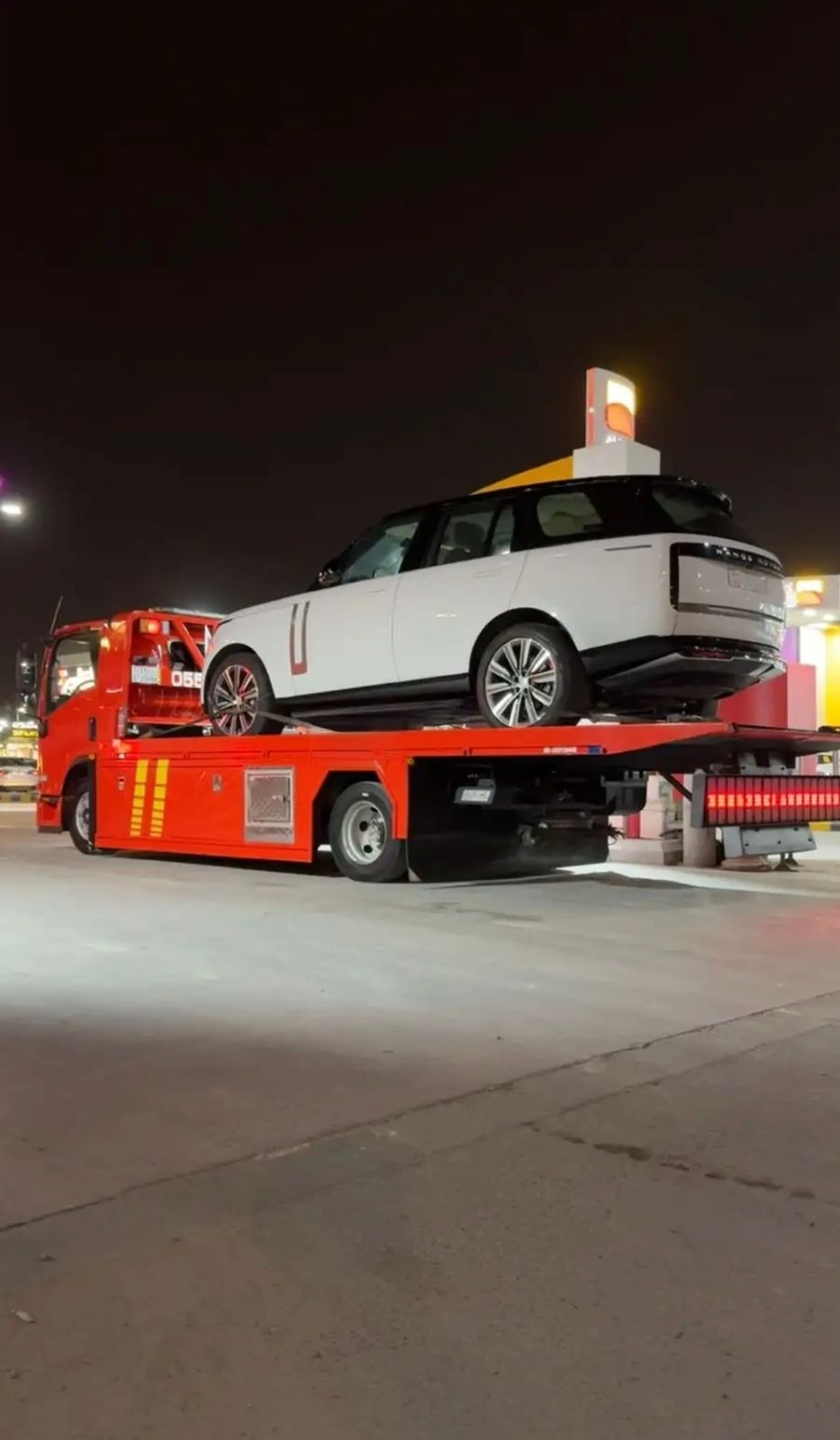 Range Rover — loaded and strapped for transport